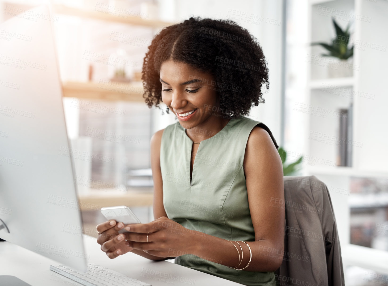 Buy stock photo Black woman, computer and cellphone networking in office as graphic designer for creative brief, proposal or chat. Female person, smile and smartphone for market research, project planning or online