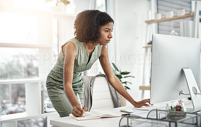 Buy stock photo Computer, planner and business woman writing in a notebook or working by her desk or table in startup. Internet, online and professional female employee or worker planning company schedule