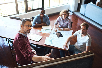 Buy stock photo Group, people and meeting for presentation in office for brainstorming, ideas and solution of sales growth. Above, team and speaker for finance, discussion and documents for feedback of profit goal