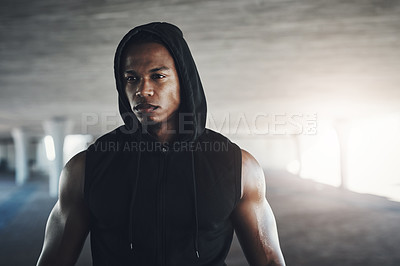 Buy stock photo Cropped shot of a handsome young man exercising outside