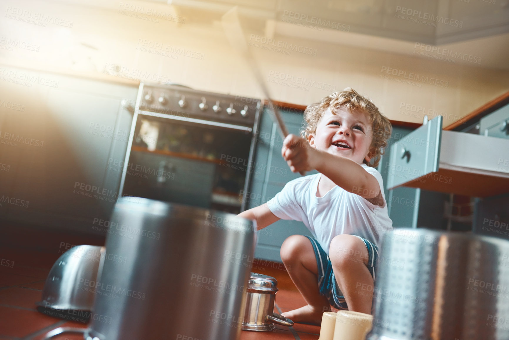 Buy stock photo Smile, child and fun with pots in kitchen for creative drums, music or sound as musician, learning or artist talent. Happy, boy and play on fantasy instrument, sensory game or development activity 