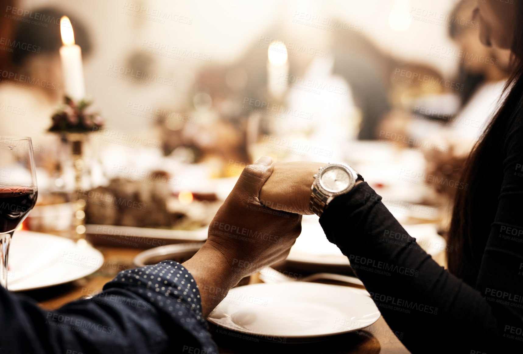 Buy stock photo Prayer, food and hand holding with family at table in dining room for holiday, thanksgiving or worship. Celebration, support and gratitude with closeup of people at home for kindness, dinner and love