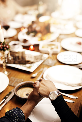 Buy stock photo Prayer, holiday and hand holding with family at table in dining room for party, food or worship. Celebration, support and gratitude with closeup of praying people at home for kindness, dinner or love