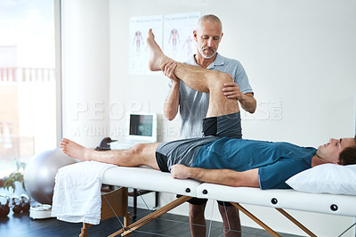 Buy stock photo Support, man and chiropractor with healing, leg and recovery with medical issue, rehabilitation and healthcare. Male person, physiotherapist or customer with pain, stretching legs or physical therapy