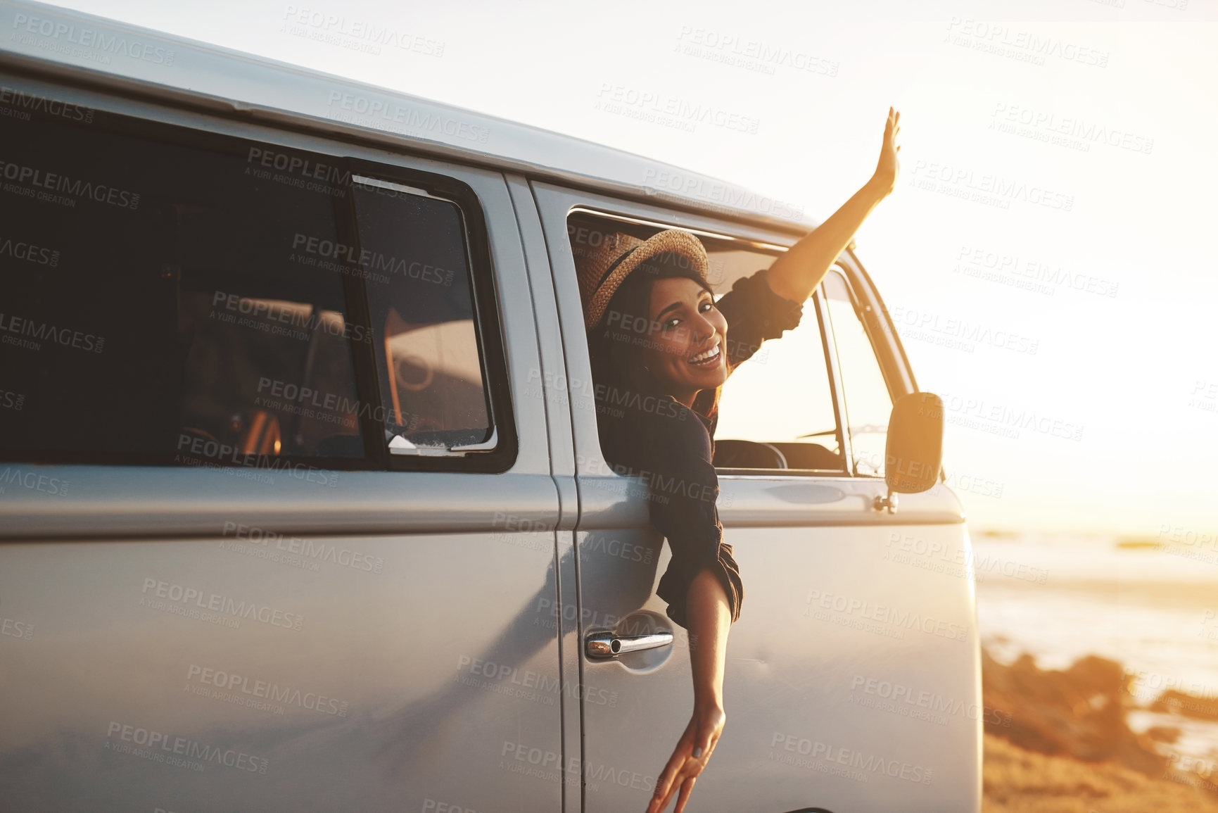 Buy stock photo Woman, portrait and freedom for road trip, sunset and adventure at beach with water, sky and view. Female person, smile and van for travel, ocean and journey outdoor with happiness, relax and peace