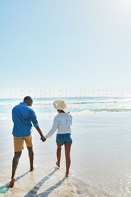 Buy stock photo Beach, walking and back of black couple holding hands, travel and enjoy outdoor quality time together. Ocean sea water, blue sky mock up or freedom peace for bonding people on Jamaica holiday mockup