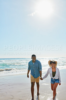 Buy stock photo Happy, laughing and black couple holding hands at the beach for love, freedom and trust in Bali. Travel, smile and black man and woman walking by the ocean during a holiday for a date in summer