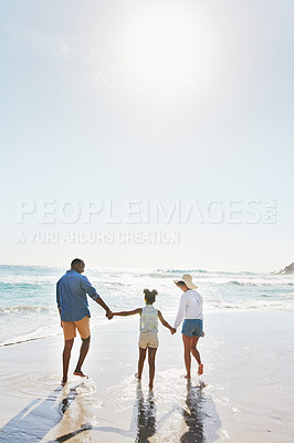 Buy stock photo Beach vacation and couple with child walking in water while holding hands together with love in summer from the back. Nature, ocean and blue sky, black family on tropical island holiday in Maldives.