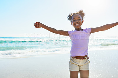 Buy stock photo Shot of an adorable little girl enjoying a day at the beach