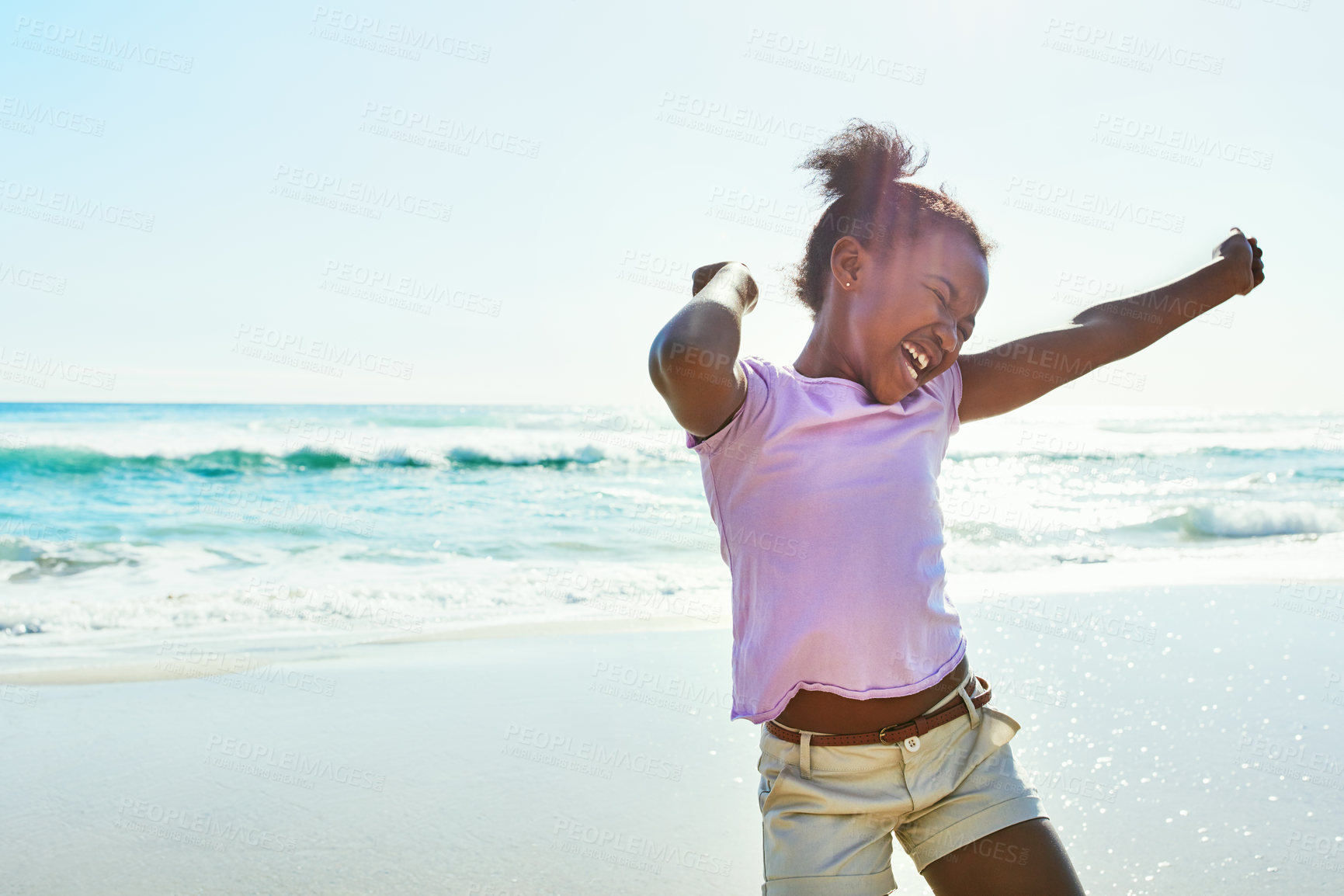 Buy stock photo Shot of an adorable little girl enjoying a day at the beach