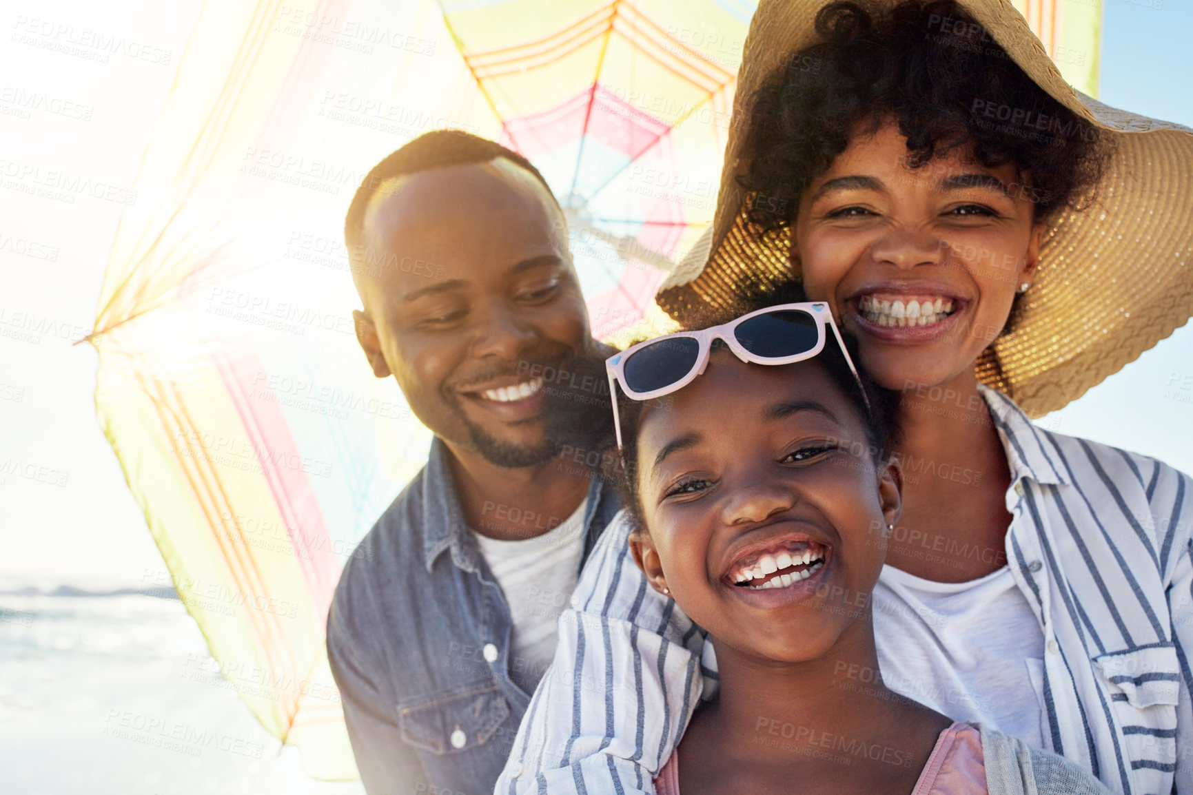 Buy stock photo Happy family, smile and beach sunshine portrait together for travel holiday, summer vacation or bonding outdoor. African parents, child happiness and relax quality time on ocean sea for adventure