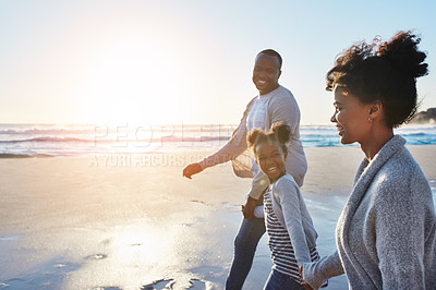 Buy stock photo Black family, sunset and walking on a beach by parents and child on vacation or holiday at the ocean or sea. Mockup, mother and father travel with daughter or kid holding hands together near water