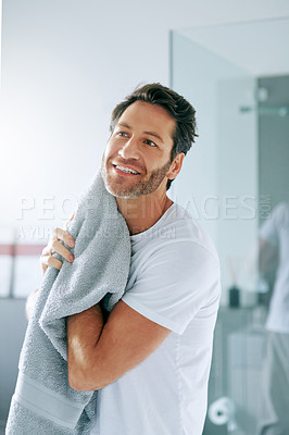 Buy stock photo Cropped shot of a handsome middle-aged man going through is morning routine in the bathroom