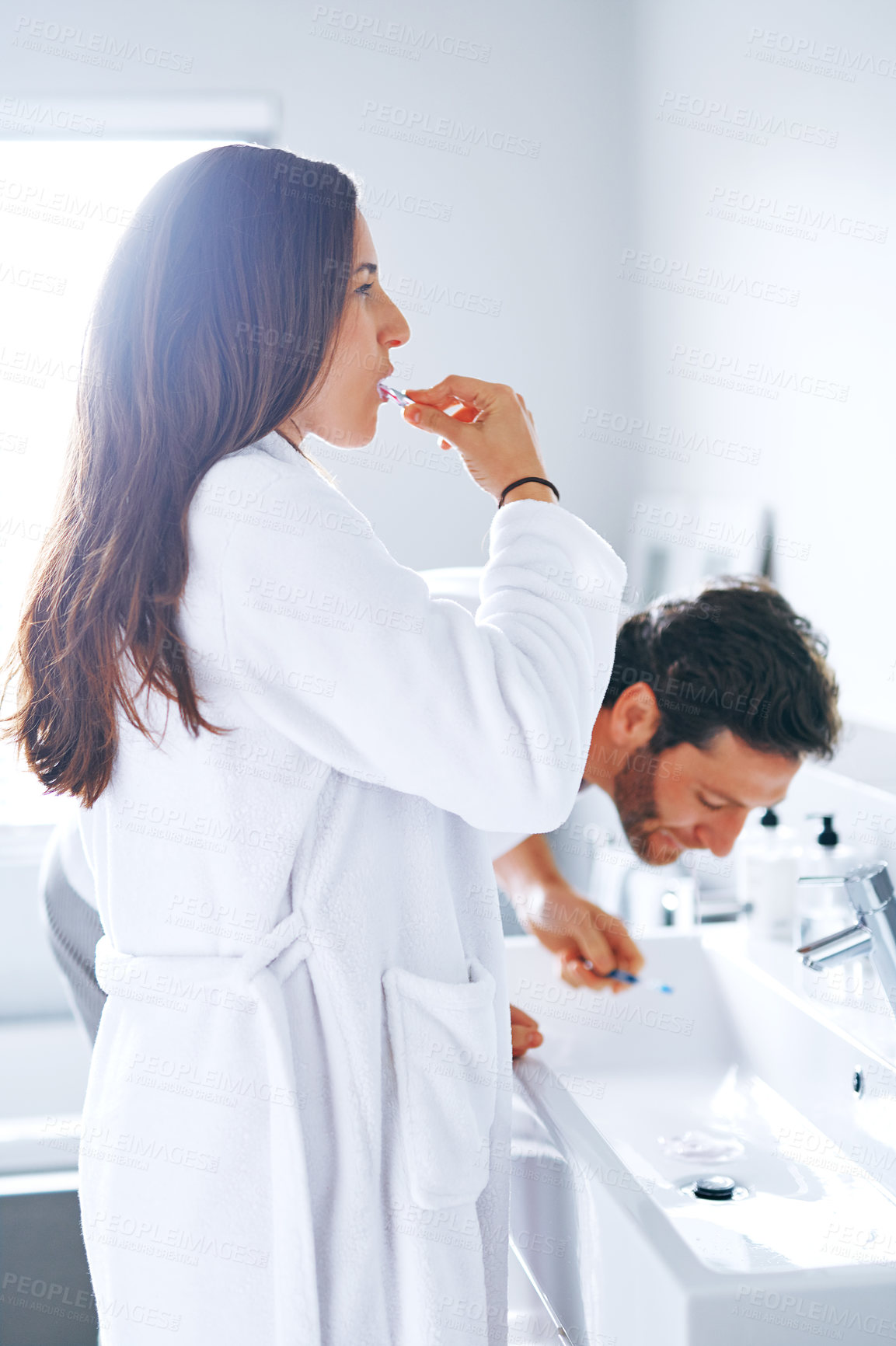 Buy stock photo Brushing teeth, sink and toothbrush with couple in bathroom for oral hygiene, breath and cleaning. Morning, wellness and dental with man and woman at home for gum treatment, toothpaste or health