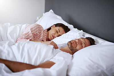 Buy stock photo Cropped shot of a middle-aged couple sleeping in bed together