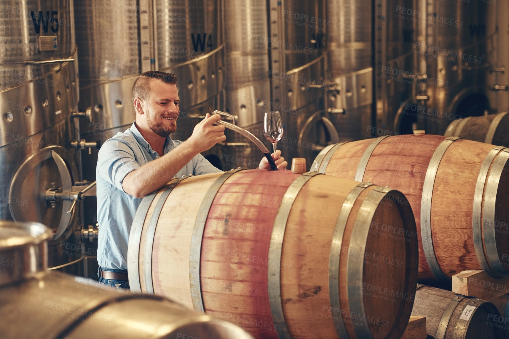 Buy stock photo Man, barrel and wine maker with glass as manager for tasting, process and production. Supplier, winery and happy or smile at product for alcohol manufacturing, craft and liquor at factory in startup