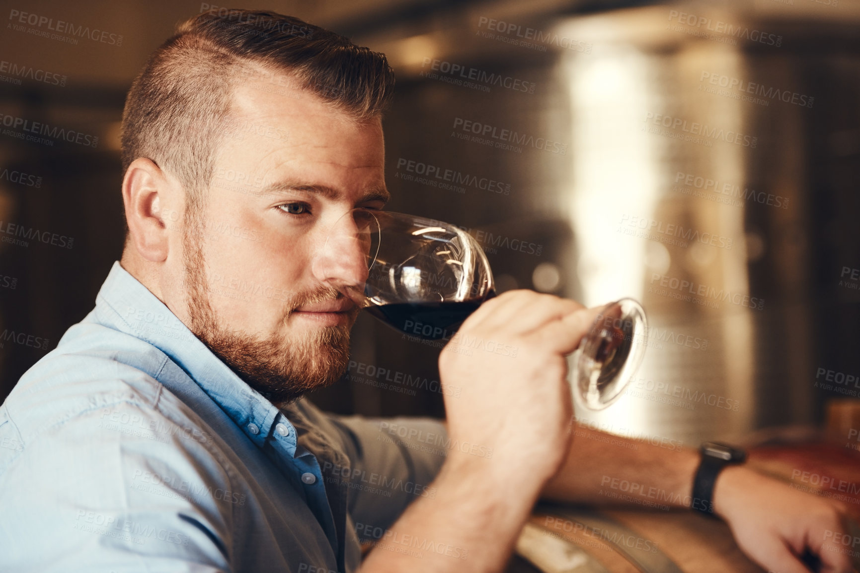 Buy stock photo Face, glass and scent with man in wine cellar for industry, manufacturing or production. Barrel, business and storage with sommelier smelling alcohol aroma at winery for distillation or fermentation