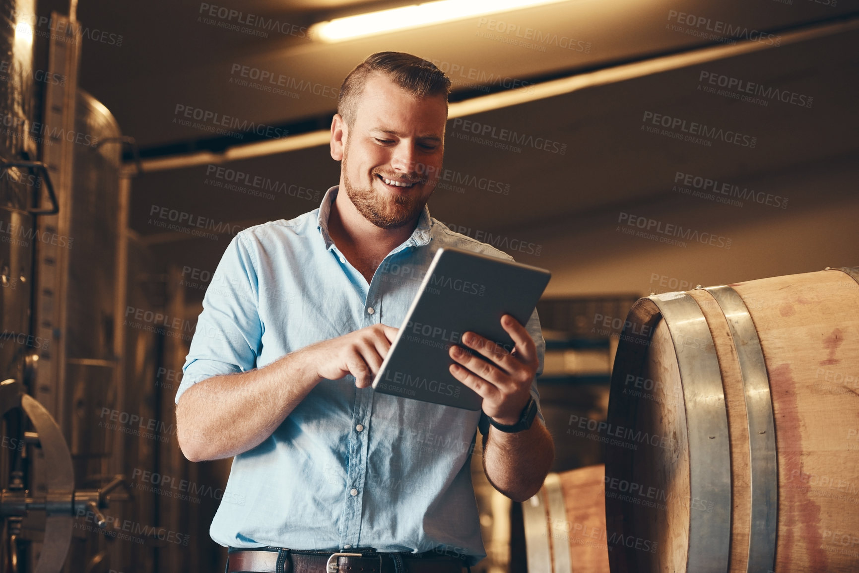 Buy stock photo Portrait, man and happy with tablet in brewery as manager with pride on product, process and schedule for supplier. Business, barrel and smile for beer production, manufacturing or craft in factory