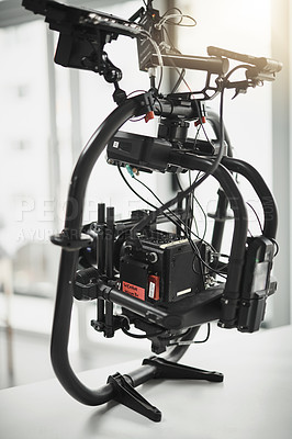 Buy stock photo Behind the scenes shot of a state of the art video camera placed on the floor of a studio during the day