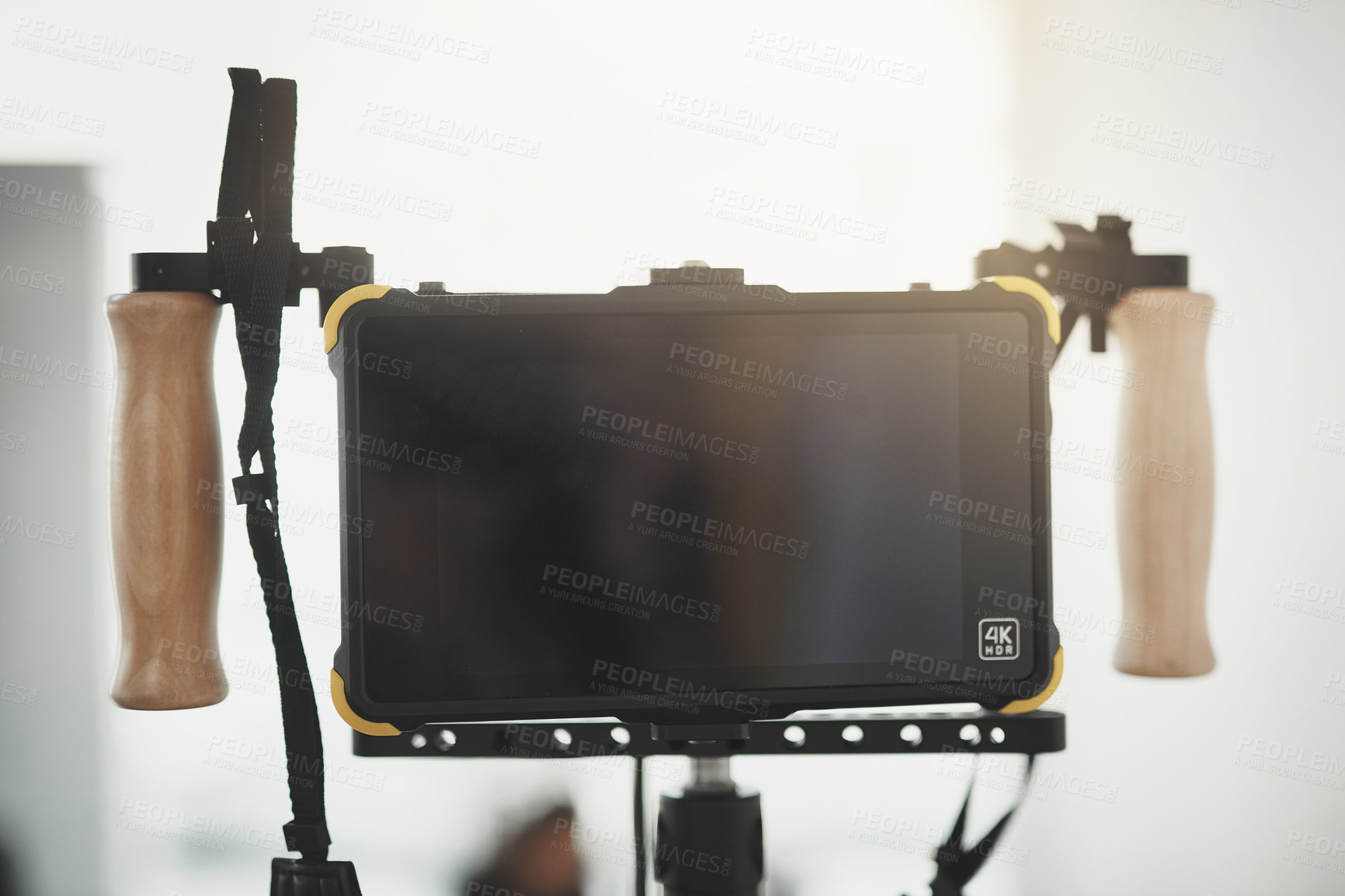 Buy stock photo Behind the scenes close up shot of videography recording equipment inside of a studio during the day