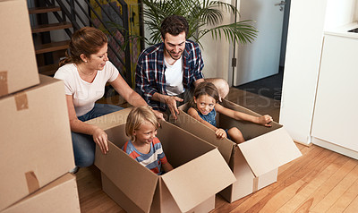 Buy stock photo Shot of a young family on their moving day