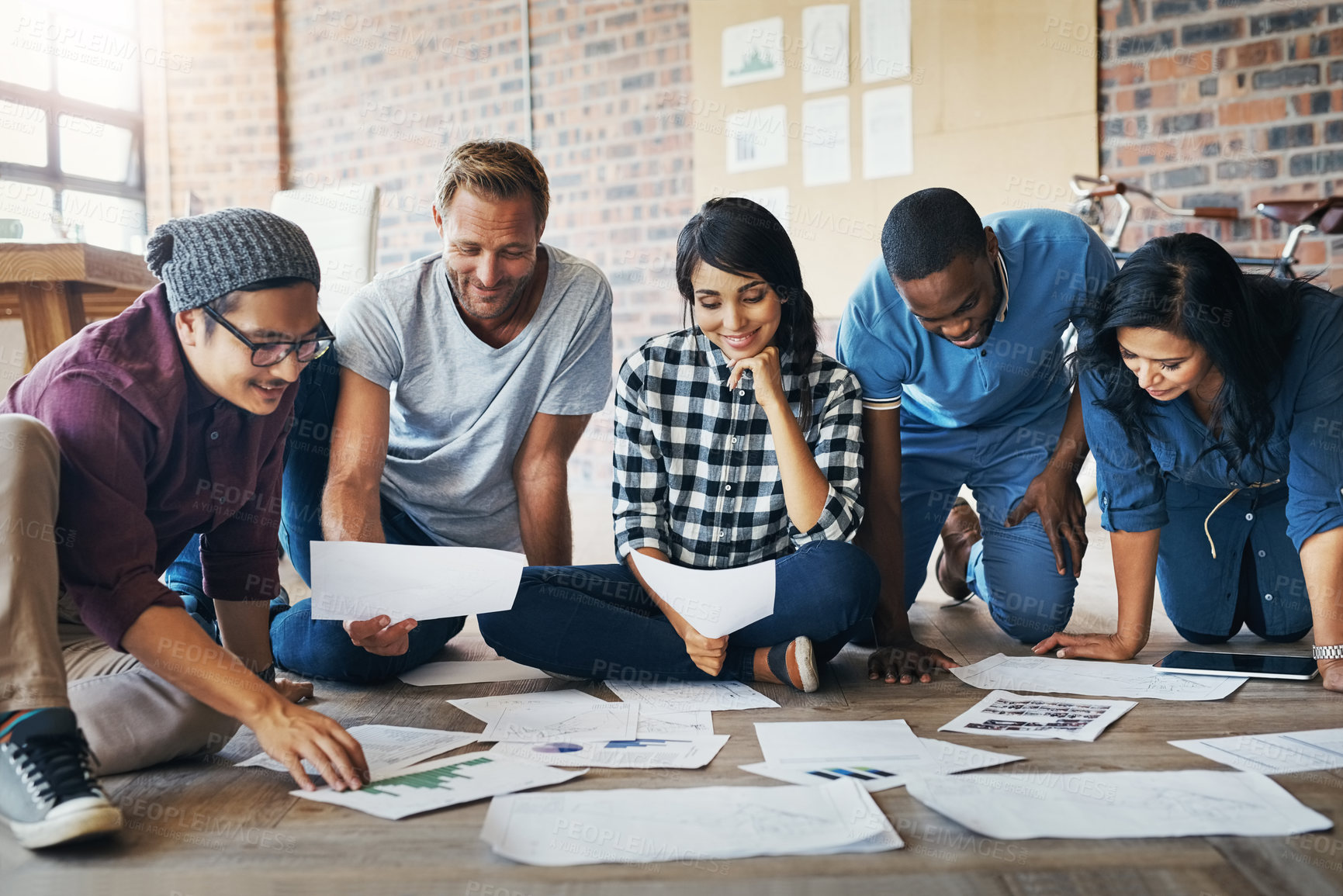 Buy stock photo People, creative and happy in office with paperwork, collaboration and research for results. Nonprofit campaign, smile and ngo in workplace with donation or fundraising growth for community charity