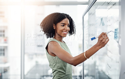 Buy stock photo Glass wall, business and black woman writing, brainstorming or strategy in office. Planning, board and happy female person write, working on project and schedule, notes or information in workplace.