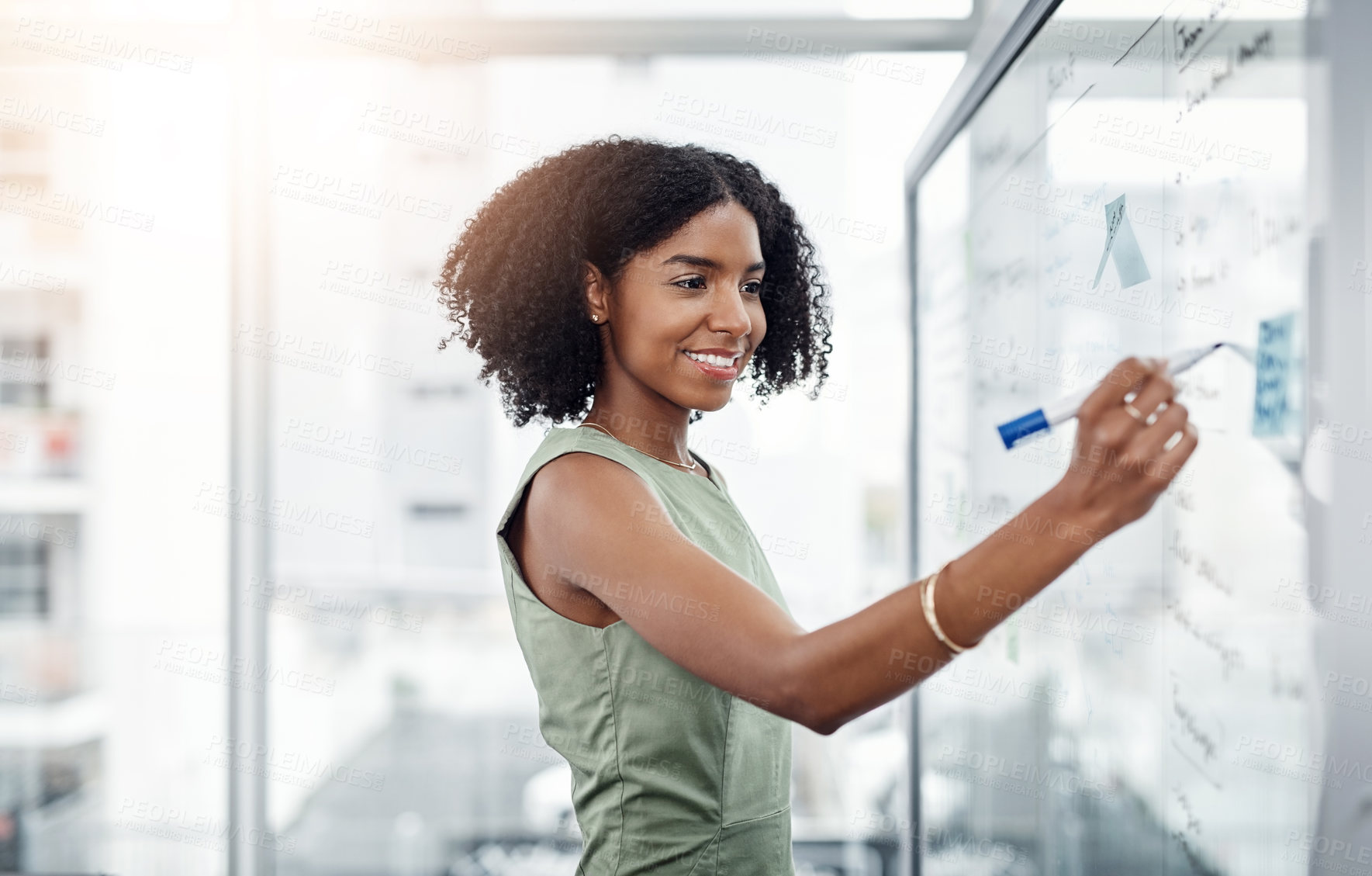 Buy stock photo Glass wall, business and black woman writing, brainstorming or strategy in office. Planning, board and happy female person write, working on project and schedule, notes or information in workplace.