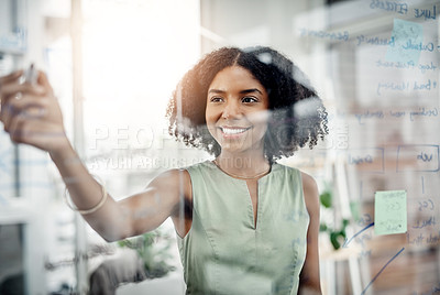 Buy stock photo Business, glass wall and black woman writing, strategy or brainstorming in office. Planning, board and happy female person write, working on project and schedule, notes or information in workplace.