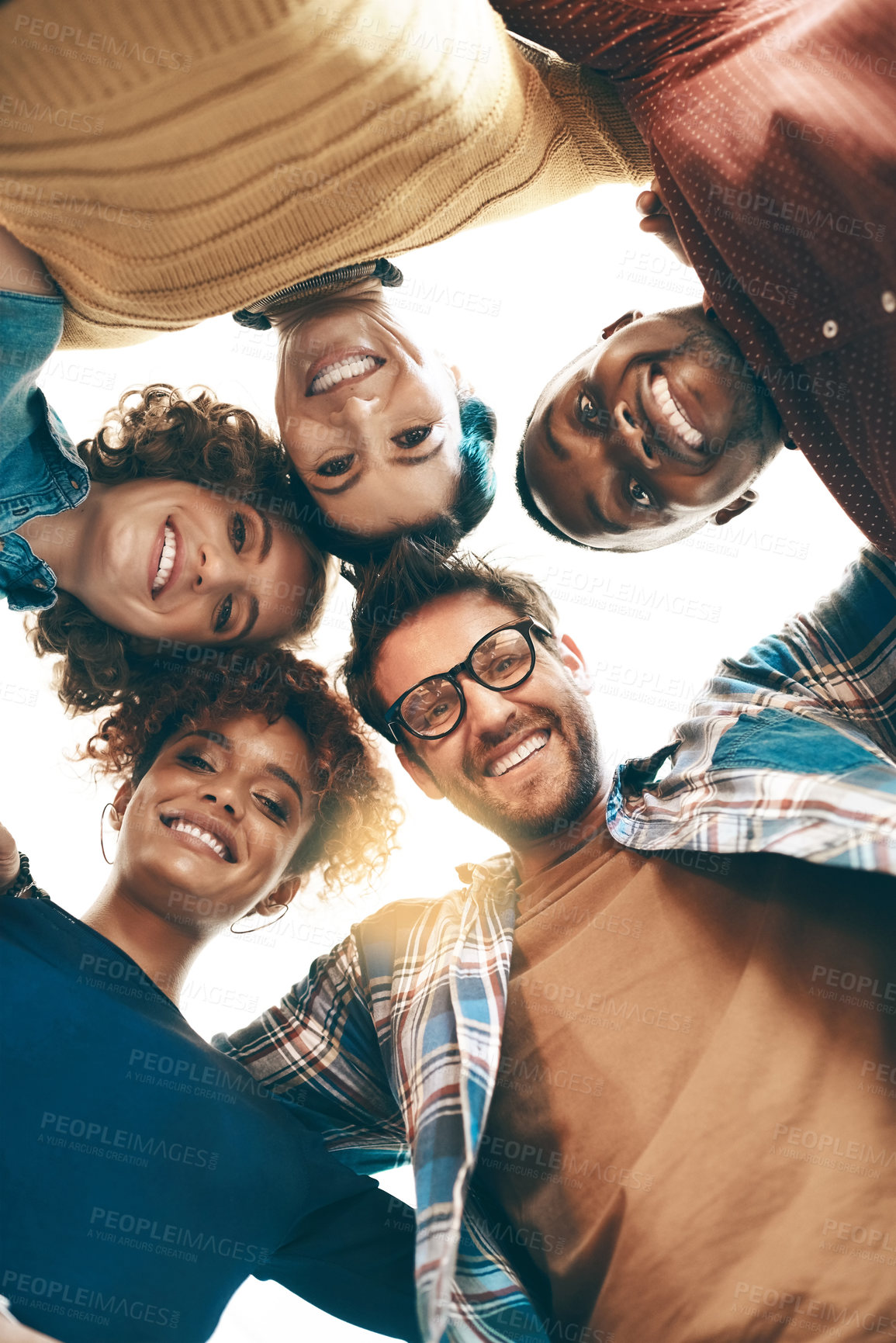 Buy stock photo Portrait of a group of designers standing together in a huddle