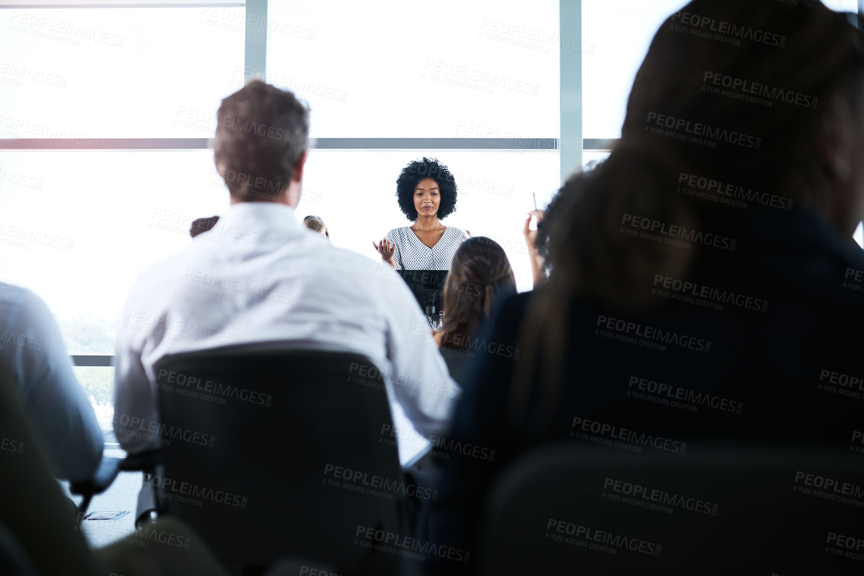 Buy stock photo Shot of a businesswoman giving a presentation at a conference