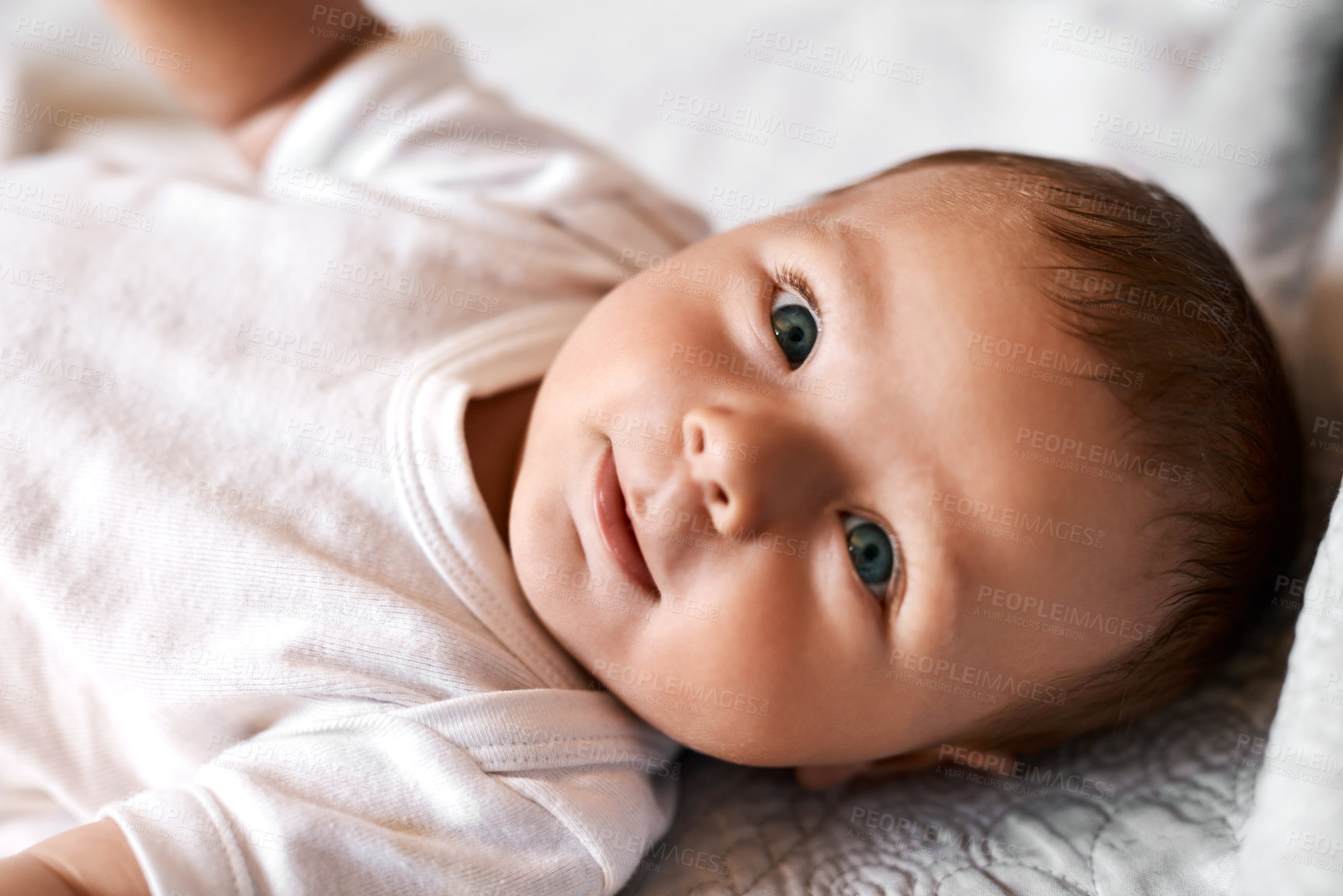 Buy stock photo Baby, portrait and boy on bed with relax for wellness, child development or comfortable in bedroom. Lying down, newborn and infant kid in nursery for curiosity, growth or morning routine in home