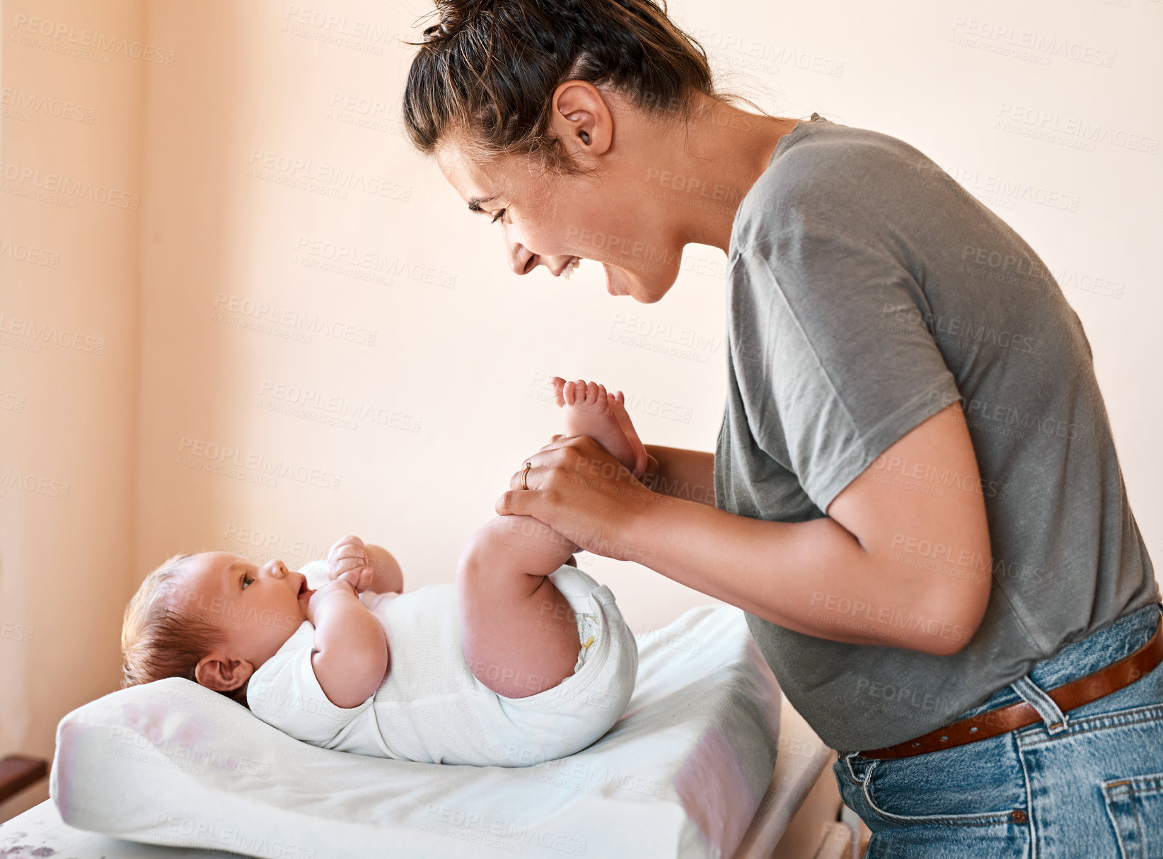 Buy stock photo Mom, baby and happy in home with bonding together, love relationship and bed for diaper change. Newborn child, smile and mother with care for healthy growth, development and replace nappy for hygiene