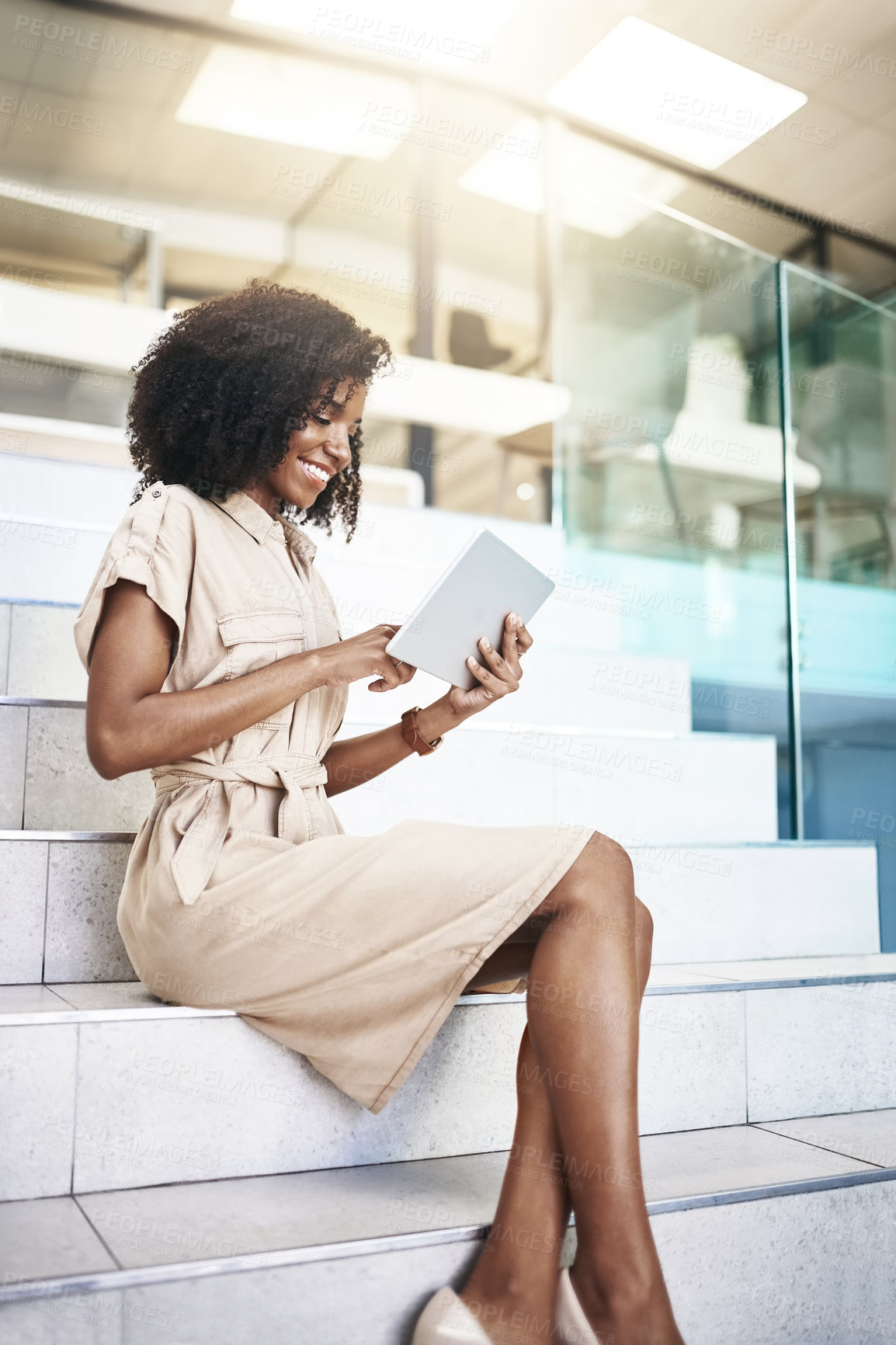 Buy stock photo Business, happy and tablet with black woman on steps in office for administration or check email. App, research and tech with smile of corporate employee reading information in professional workplace