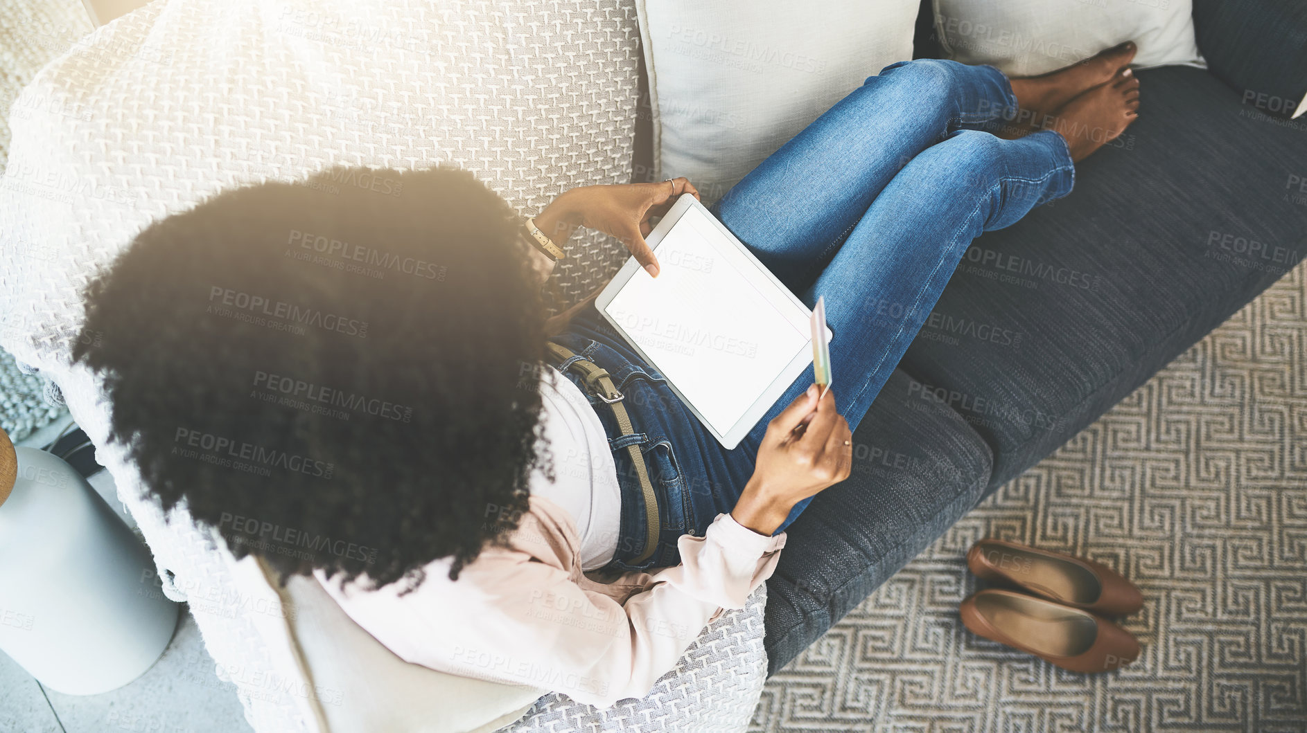 Buy stock photo Shot of an attractive young woman relaxing at home