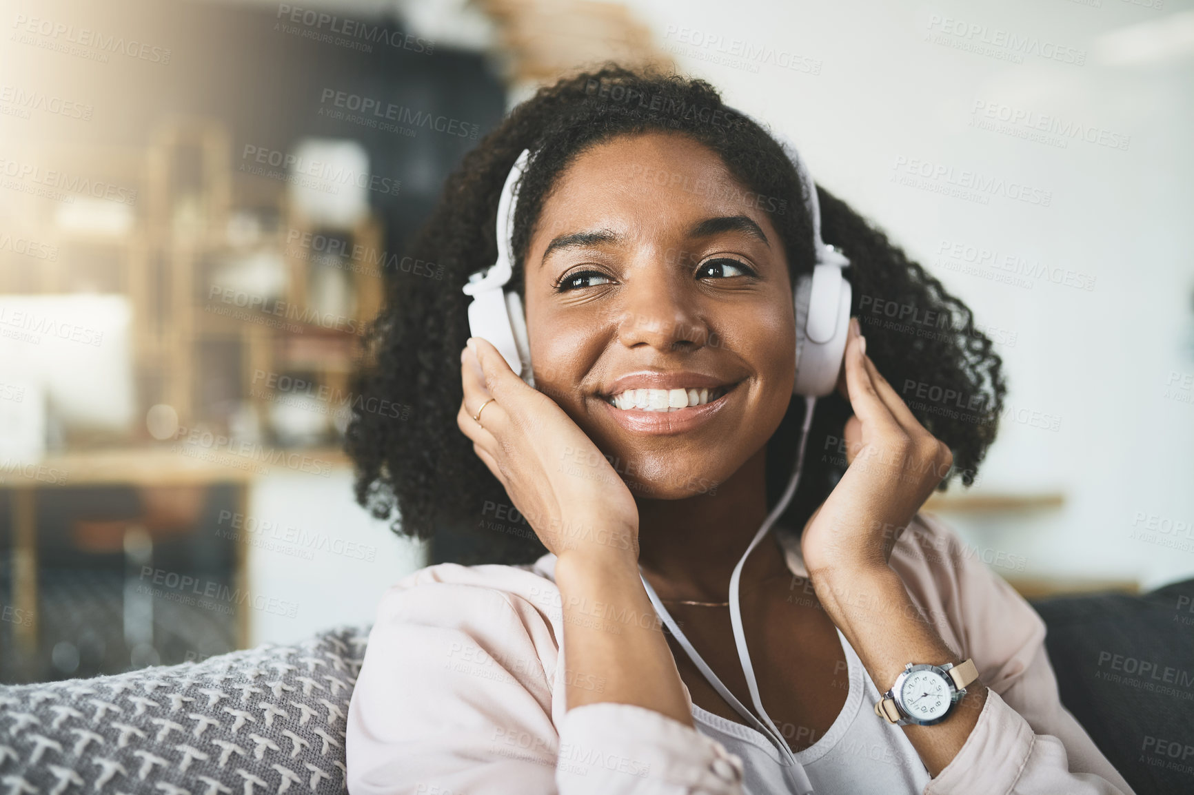 Buy stock photo Home, smile and black woman on sofa, headphones and listening to music, song and audio. African person, apartment and girl with headset, happiness and podcast for stress relief, thinking and sound