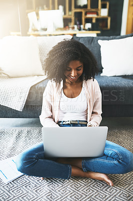 Buy stock photo Home, laptop and black woman on floor, smile and typing with connection, website info and joy. African person, apartment and girl with computer, research and student with online assignment or relax