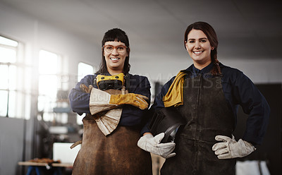 Buy stock photo Cropped portrait of two attractive young female artisans standing in their workshop