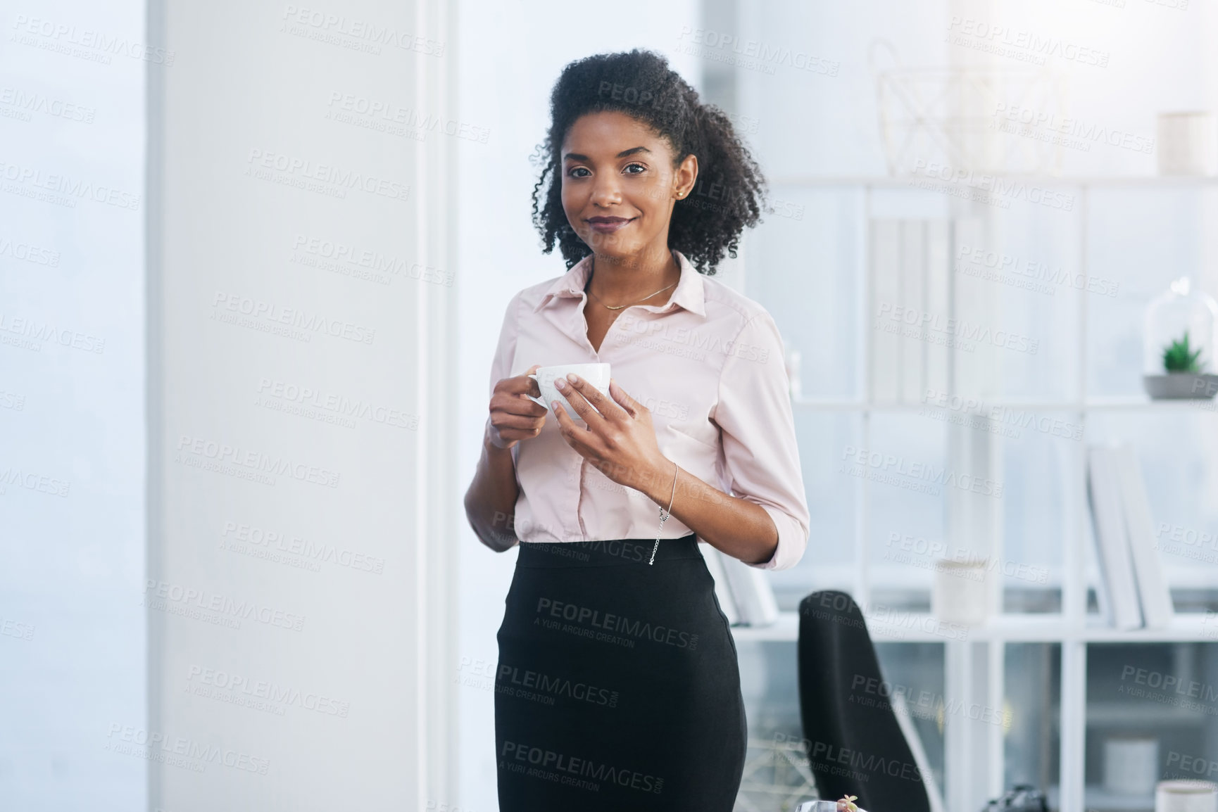 Buy stock photo Portrait of a young businesswoman drinking a cup of coffee in an office