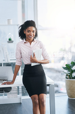 Buy stock photo Portrait of a young businesswoman holding a digital tablet in an office