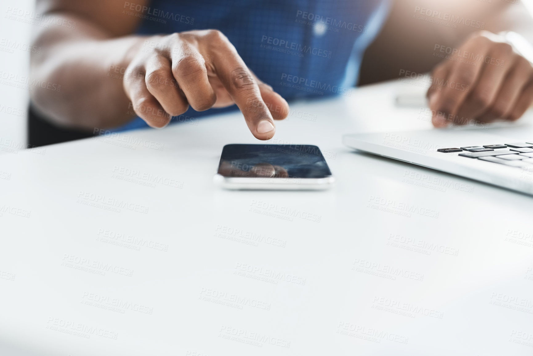 Buy stock photo Closeup shot of an unrecognizable businessman using a cellphone in an office