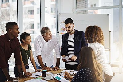 Buy stock photo Cropped shot of a group of creative employees working in a modern office