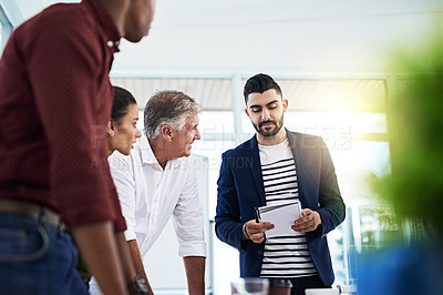 Buy stock photo Cropped shot of a group of creative employees working in a modern office