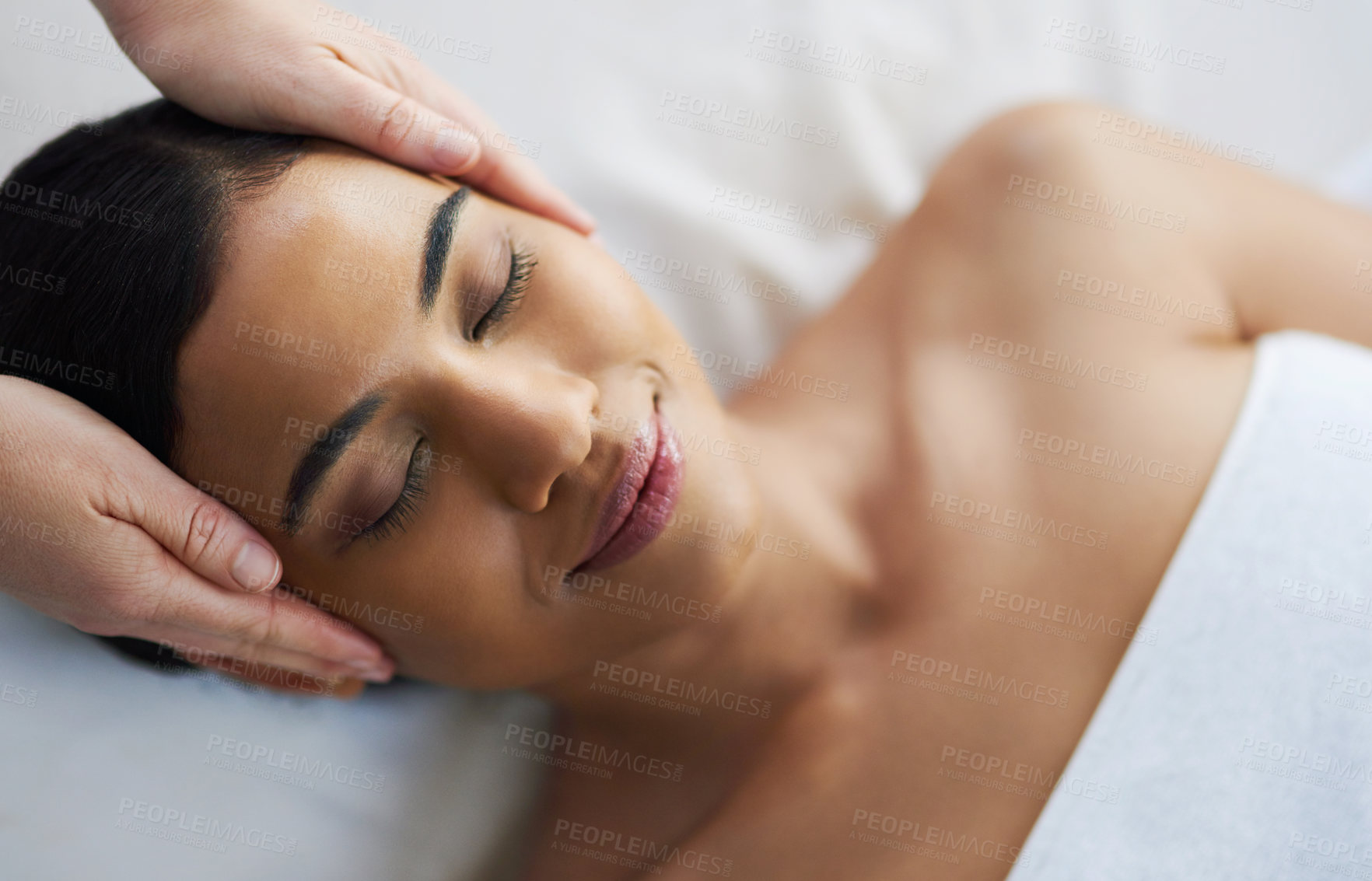 Buy stock photo Shot of an attractive young woman getting a massage at a spa