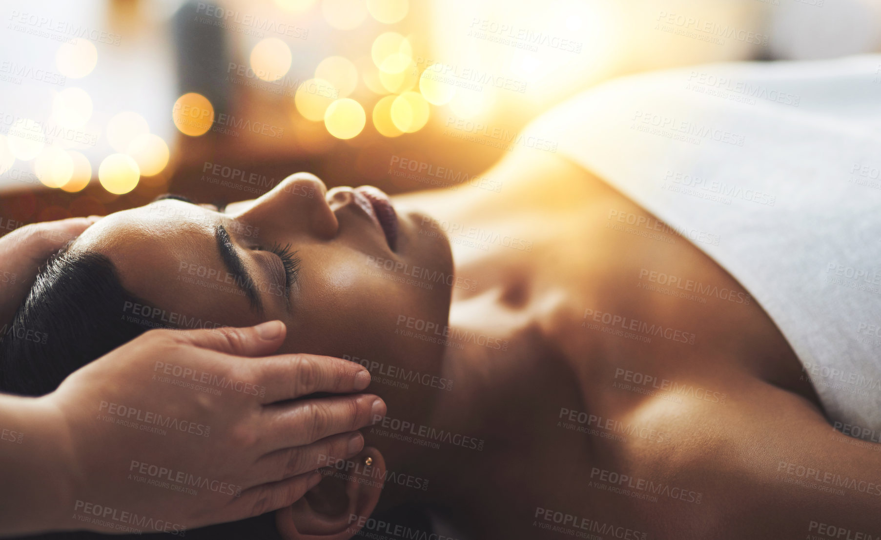 Buy stock photo Shot of an attractive young woman getting a massage at a spa