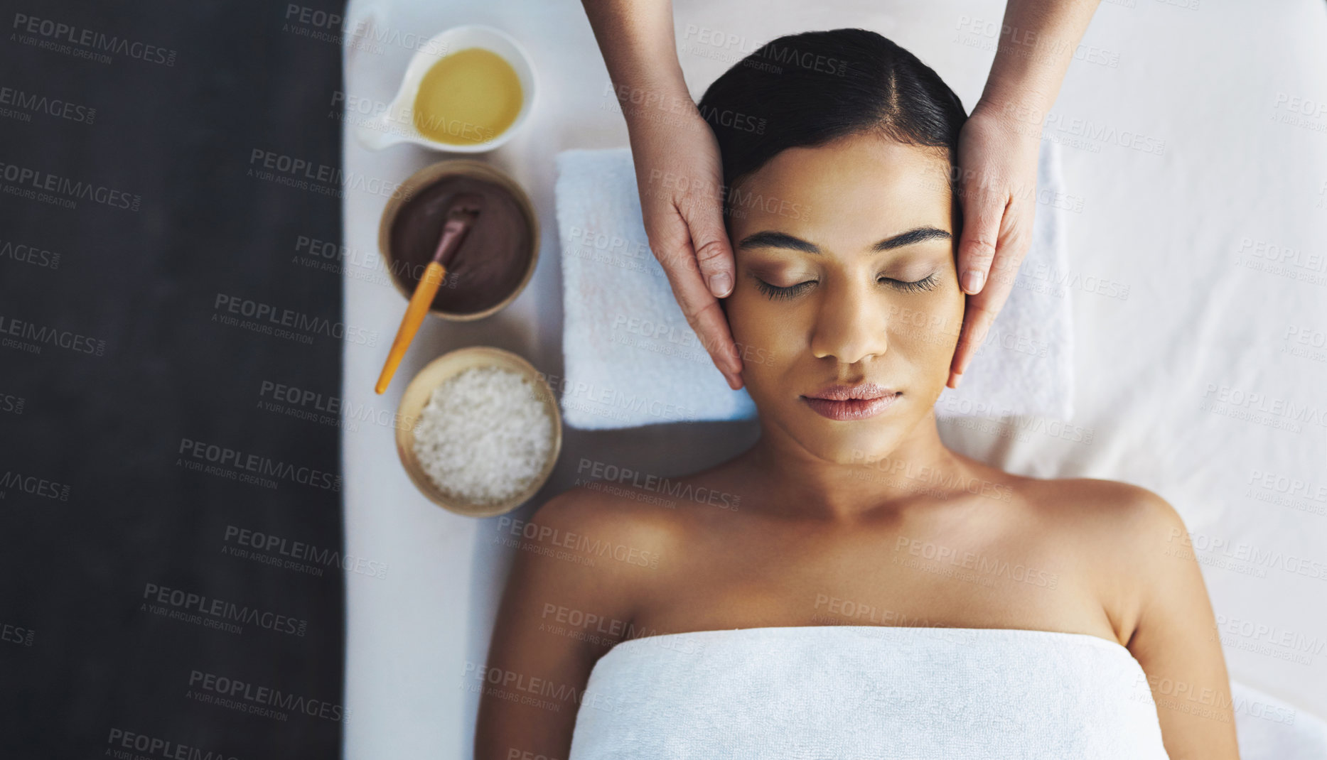 Buy stock photo Shot of an attractive young woman getting a massage at a spa