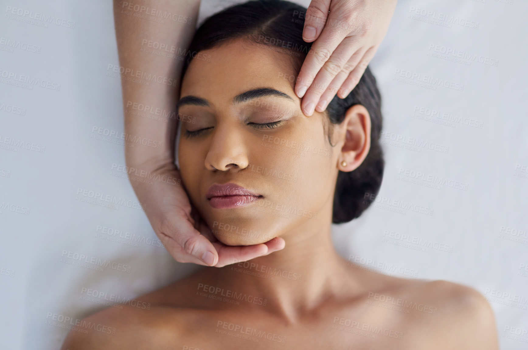 Buy stock photo Shot of an attractive young woman getting a massage at a spa