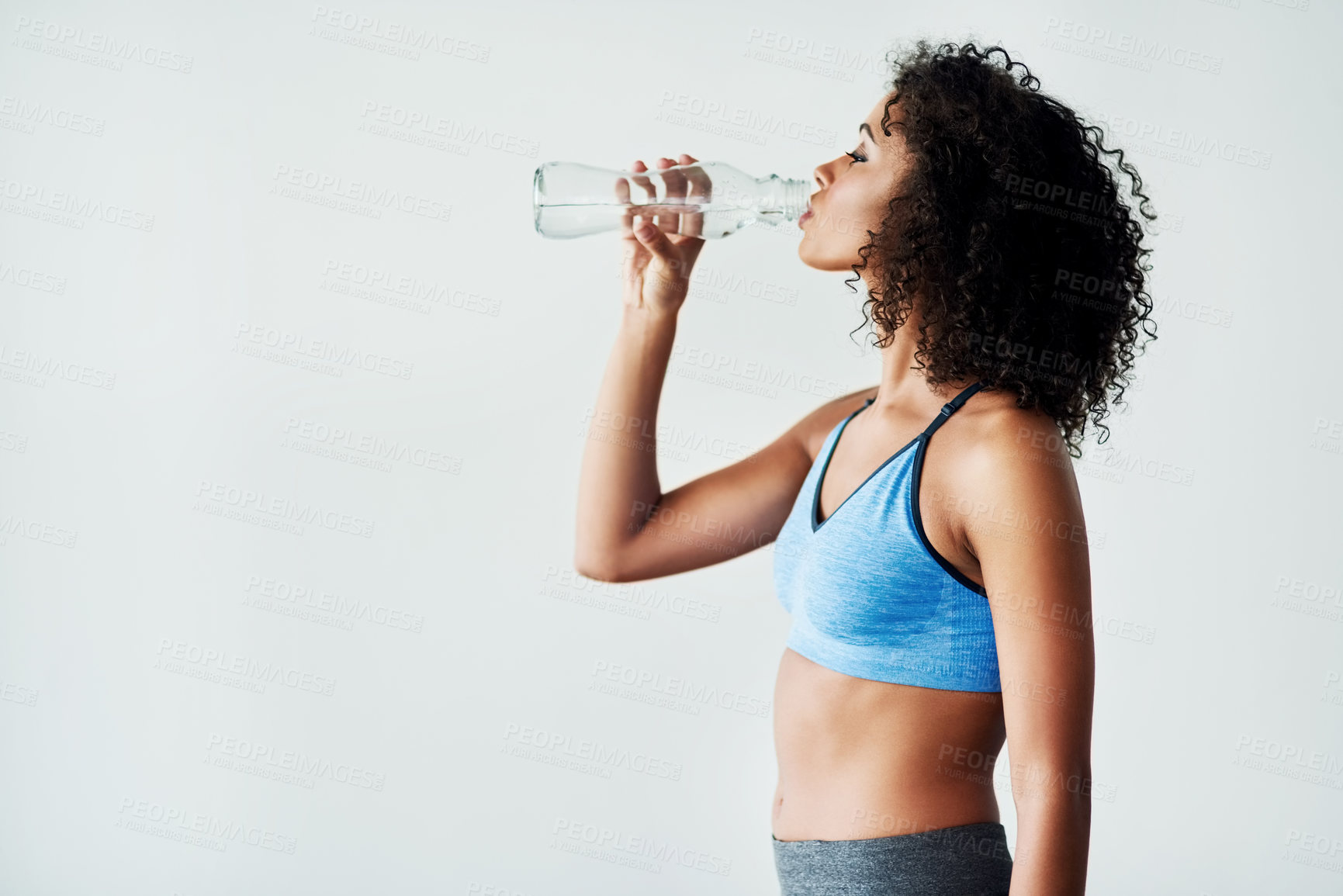 Buy stock photo Woman, training and drinking water in studio with fitness for hydration, break and thirsty of exercise with mockup. Athlete, person or liquid bottle for relax, wellness or refresh on white background