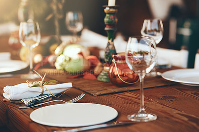 Buy stock photo Table, wine glass and plate for festive holiday meal, drinking and celebration with blurred background. Fine dining, party and glass for wine at feast, dinner or lunch in home, house or restaurant