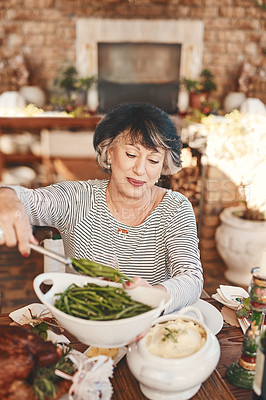 Buy stock photo Thanksgiving table and senior woman with vegetables serving at food party for USA celebration. Holiday, celebrate and mature festive person at home dining table with green beans for nutrition.